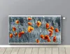 A radiator cover with a printed image of poppies in a field is mounted on a gray wall above a wooden floor. Anteprima dell’immagine prodotto