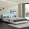 A modern bedroom with a white bed and blue LED lights. Náhled obrázku produktu