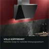 A modern kitchen with a black range hood installed above a stovetop with steam rising. Produktbild-Vorschau