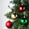 A close-up of a Christmas tree with ornaments. Náhled obrázku produktu