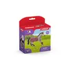 A toy horse and accessories in its packaging, set against a plain white background. Produktbild-Vorschau