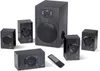 A 5.1 speaker system with a subwoofer and four satellite speakers, along with a remote control, is arranged on a white background. Produktbild-Vorschau