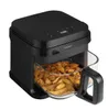 A black air fryer with a glass basket filled with potato wedges. Produktbild-Vorschau