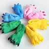A collection of colorful monster paw slippers arranged in a circle. Produktbild-Vorschau