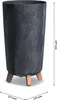 A tall, cylindrical planter with a stone-like texture and three wooden legs, shown with dimensions indicated. Anteprima dell’immagine prodotto