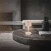 A modern living room with a fireplace and a coffee table. Náhľad obrázku produktu