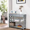 A gray console table with decorative items and books is shown in a room. Podgląd zdjęcia produktu