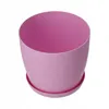 A pink flower pot with a saucer on a white background. Anteprima dell’immagine prodotto