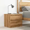 A wooden nightstand with two drawers next to a bed. Anteprima dell’immagine prodotto