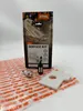 A Stihl service kit box with a spark plug, fuel filter, and air filter laid out in front of it on a patterned plastic sheet. Produktbild-Vorschau