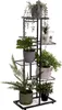 A multi-tiered metal plant stand filled with various artificial plants, photographed against a white background. Náhľad obrázku produktu