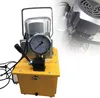 A close-up studio shot of a yellow and silver electric hydraulic pump with a pressure gauge. Podgląd zdjęcia produktu