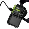 A close-up of a Vayox rechargeable battery pack for a headlamp, showing it plugged into a USB-C cable. Anteprima dell’immagine prodotto