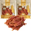 Two bags of dog treats with a pile of treats in front. Produktbild-Vorschau