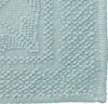 A close-up view of a textured bath mat. Produktbild-Vorschau