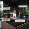 A modern kitchen counter with a glass electric kettle, kitchen utensils, and decorative plants. Náhľad obrázku produktu