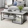 A living room scene with a couch and a coffee table. Produktbild-Vorschau