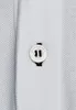 Close-up of a button on a white polo shirt. Produktbild-Vorschau