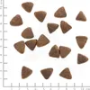 A collection of dog food kibble pieces arranged on a white background with a ruler for scale. Anteprima dell’immagine prodotto