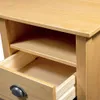 A close-up view of an open drawer and shelf of a wooden desk. Podgląd zdjęcia produktu