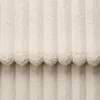 A close-up view of a cream-colored fabric with vertical ribbed texture. Produktbild-Vorschau