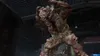 A mutated creature, likely a 'Clicker' from The Last of Us, lunges forward in a dark, industrial-looking environment. Produktbild-Vorschau