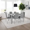 A dining room with a table and chairs set up. Náhled obrázku produktu