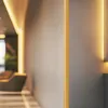A blurred interior scene with warm lighting, possibly a modern hallway or lobby. Anteprima dell’immagine prodotto