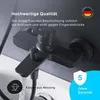 A black bathroom faucet with water flowing from the spout, set against a dark gray background with text overlays highlighting quality and warranty. Produktbild-Vorschau