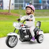A young child rides a toy police motorcycle outdoors on a paved path, with grass and trees in the background. Náhľad obrázku produktu