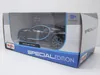 A toy model car in its packaging. Voir les images du produit