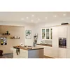 A modern kitchen with a central island and white cabinets. Produktbild-Vorschau