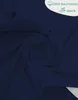 A dark navy blue fabric is swirled and folded, creating a textured appearance. A white overlay in the top right corner contains text and icons. Produktbild-Vorschau