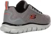 A side view of a gray Skechers sneaker. Voir les images du produit