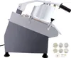 A commercial vegetable slicer with multiple cutting discs. Podgląd zdjęcia produktu