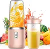 A pink portable smoothie maker is shown with a second cup filled with smoothie, surrounded by various fruits. Produktbild-Vorschau