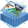 A stack of blue puzzle mats with water splashing around them. Produktbild-Vorschau