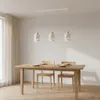 A dining table with chairs and a pendant light fixture above it. Náhľad obrázku produktu