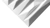 A close-up, angled view of a white 3D wall panel with a geometric, faceted design. Podgląd zdjęcia produktu