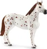 A toy horse with brown spots on a white background. Produktbild-Vorschau