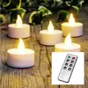 Five LED tea lights are arranged on a wooden surface, with a remote control in the foreground. Produktbild-Vorschau