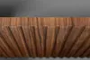 A close-up view of a wooden surface with parallel grooves and a textured top edge. Náhled obrázku produktu