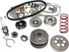 A collection of scooter parts, including a belt, rollers, clutch, and spark plug, arranged on a white background. Produktbild-Vorschau