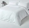 A white duvet cover and pillowcases are neatly arranged on a bed. Produktbild-Vorschau