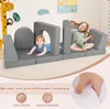 Two young children playing on a modular foam play sofa indoors. Voir les images du produit