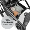 Close-up view of the storage basket of a stroller, filled with baby items, with text overlay. Produktbild-Vorschau