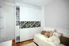 A bedroom with a white wardrobe and a daybed with stuffed animals. Náhled obrázku produktu
