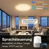 A modern living room with a large sectional sofa, fireplace, and city view, featuring smart home devices and a ceiling light. Produktbild-Vorschau
