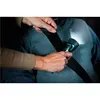 A person is using a flashlight to inspect a seatbelt. Produktbild-Vorschau