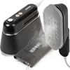 A black and silver Duronic handheld garment steamer and iron with steam emitting from the ironing plate. Produktbild-Vorschau